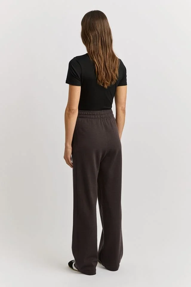 Back view of a woman Woman wearing the Date (brown) colour variant of the Toorallie | Lounge Lounge Pants