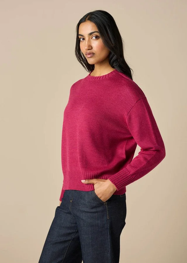 woman wearing the Magenta colour of the Matilda Jumper from uimi knitwear.