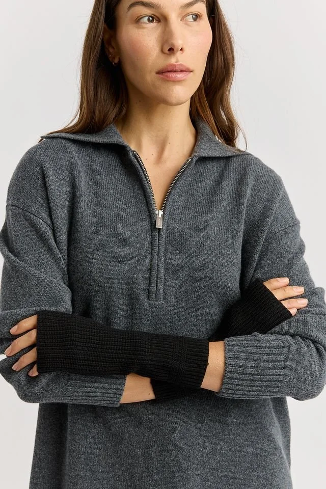 Woman wearing the black colour variant of the Toorallie open mitten.