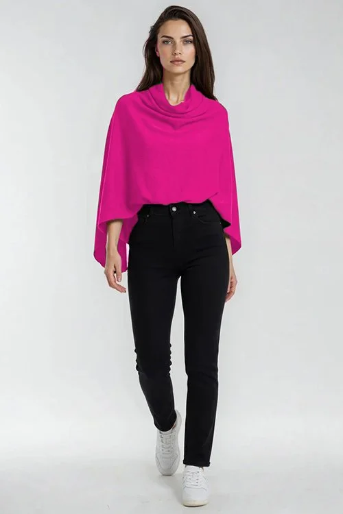 Woman wearing the Fuchsia (bright pink) colour variant of the Bridge & Lord Wrap Topper