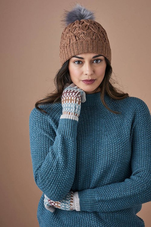 Woman wearing a Mabel beanie made by uimi knitwear with 100% merino wool. Gingerbread brown colour variant.