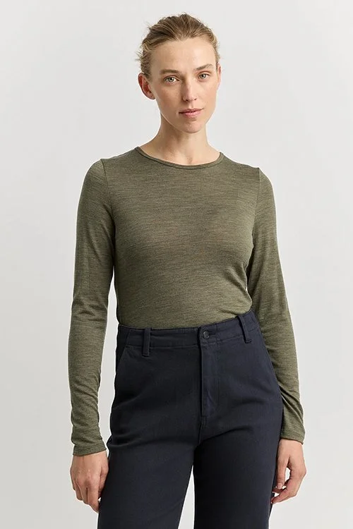 Woman wearing the Toorallie — Merino Wool Crew Tee - Kale (olive green) colour variant