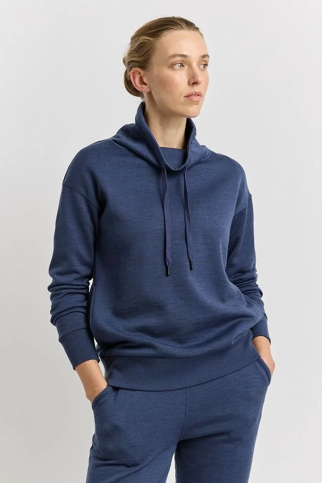 Woman wearing the Toorallie | Lounge Funnel Neck Sweater (Merino wool + Cotton), Galaxy (blue) colour variant