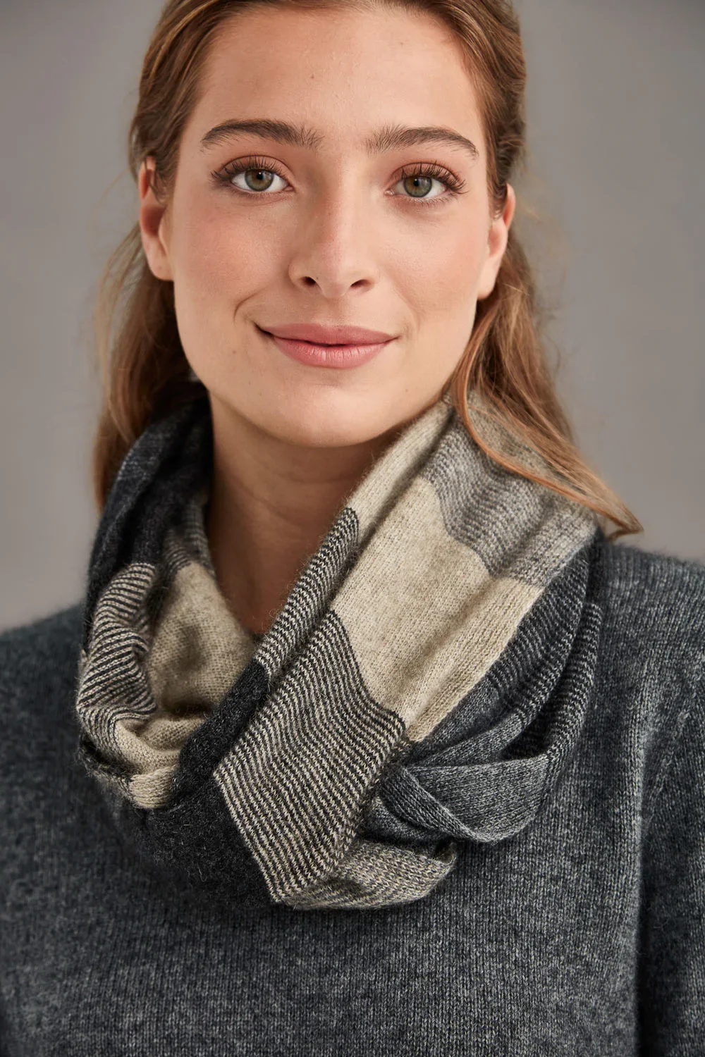 Woman wearing the Ombre Snood in the sepia colourway. Made by McDonald Textiles