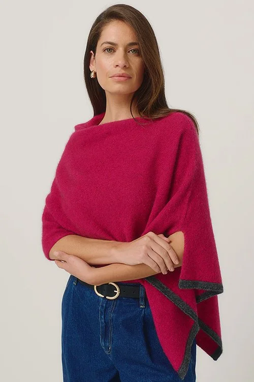 Woman wearing the MerinoMink™ Two-tone Poncho made Merino Wool, Possum Fur, and silk in the Lupin colour variant