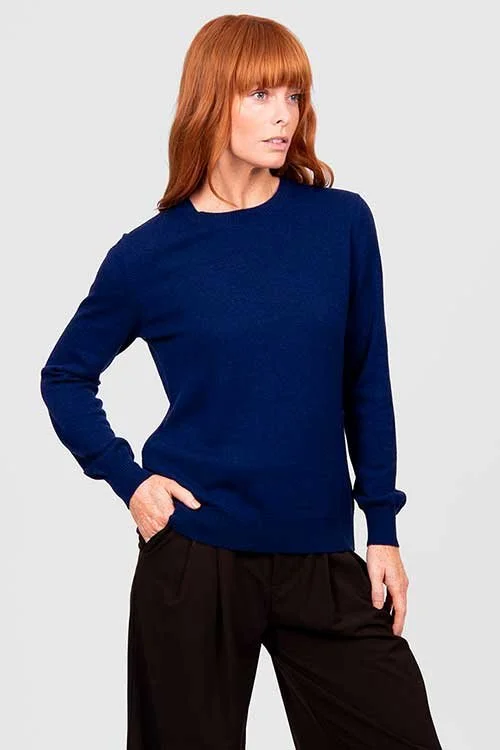 Woman wearing the Cobalt Blue colour variant of the Bridge & Lord crew neck jumper