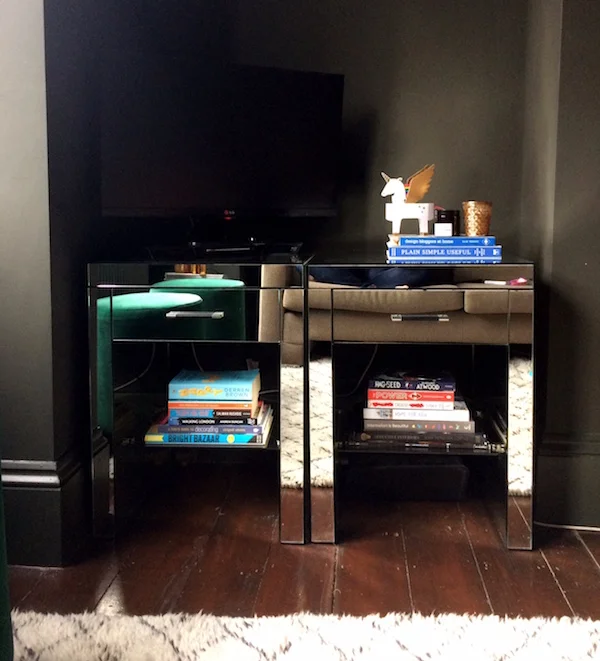 Bedside cabinets as a TV stand. Decorating tricks like shopping your home can save hundreds.