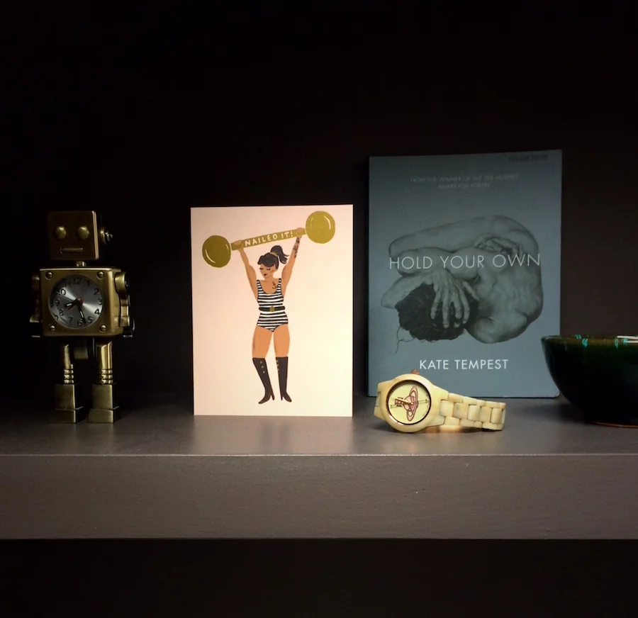 Inexpensive things like greetings cards and book covers used as art