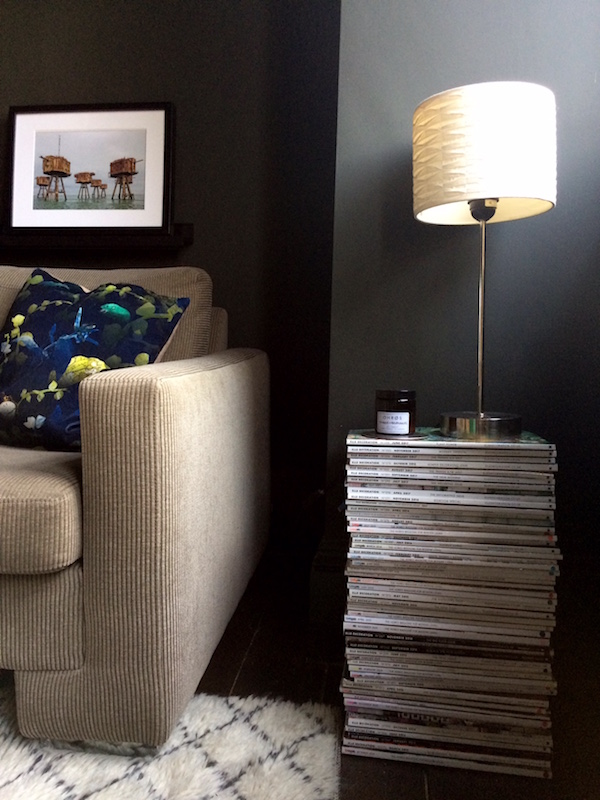 Decorating tricks to save money. Try a stack of magazines as a side table