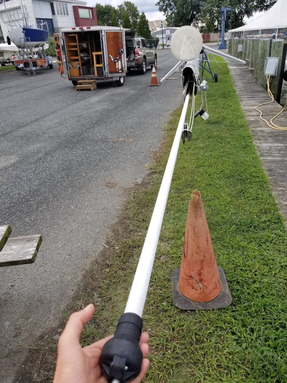 With everything rebuilt, we slide the extrusion back into the mast. Reconnecting the extrusion to the furling gear was challenging because there’s very little room to reach in to bend the cotter pin! Persistence prevailed.