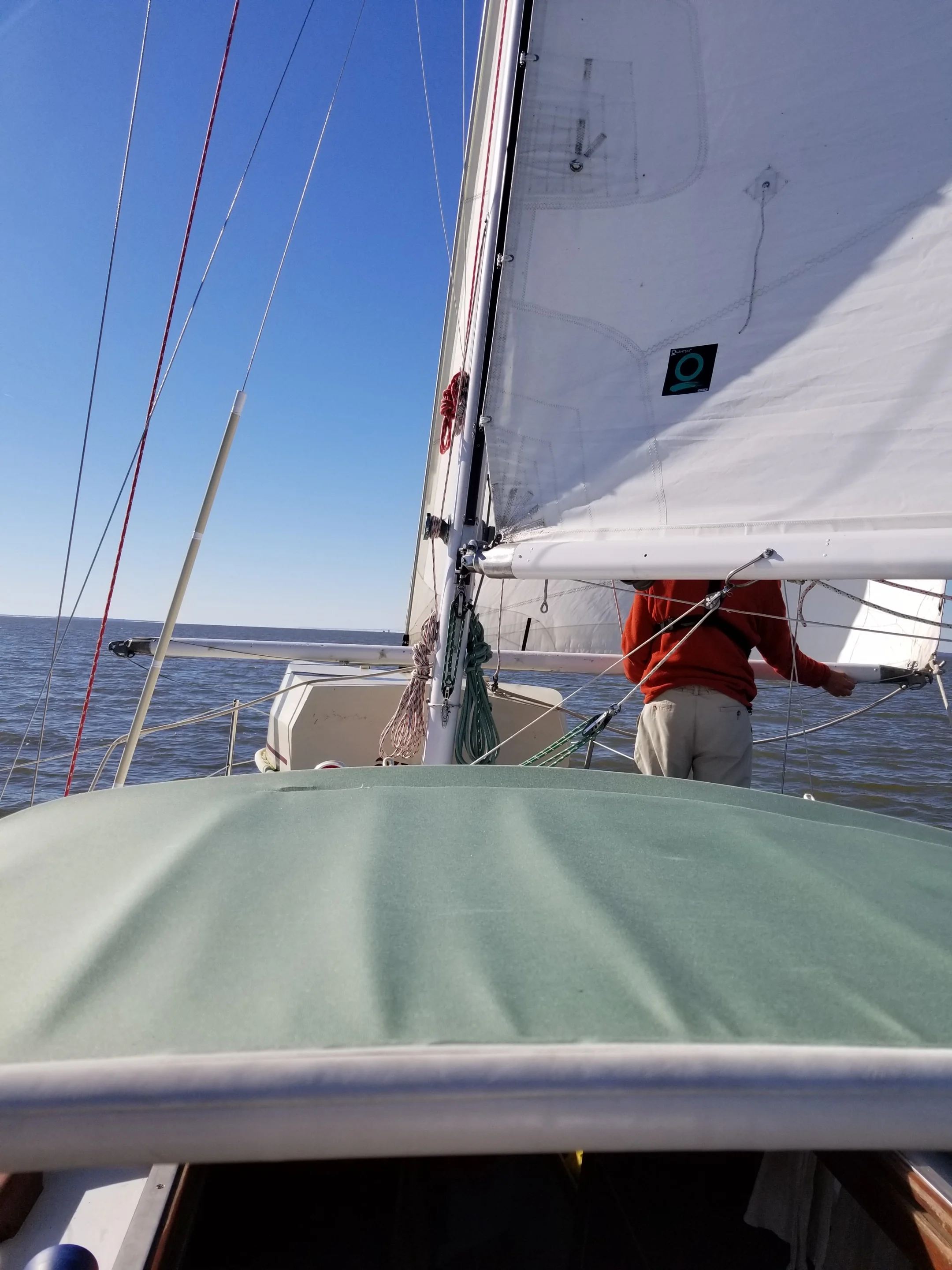 Dobbs sets the spinnaker pole as a whisker pole for the 135% genoa.