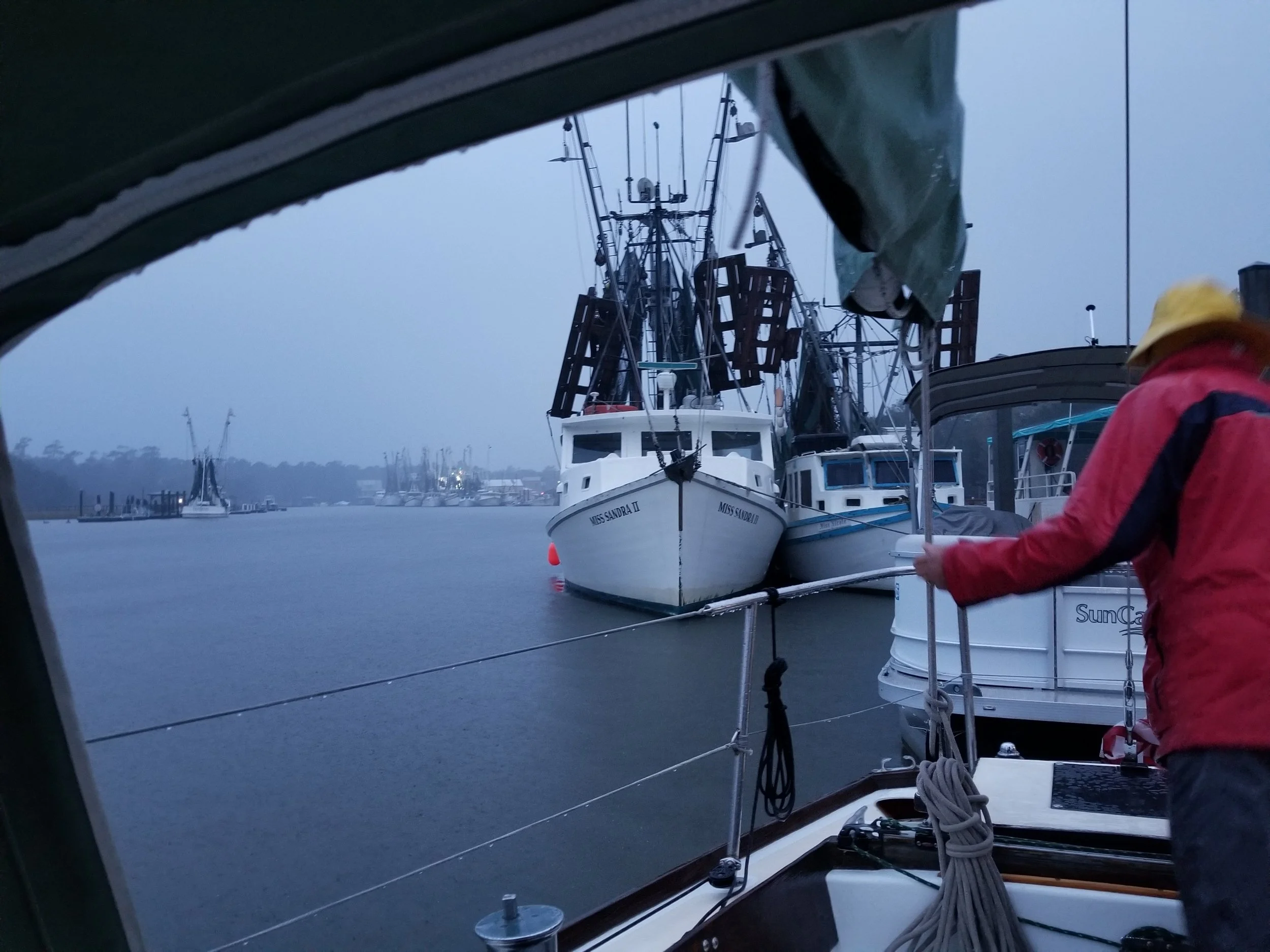 Preparing to cast off before dawn in pouring rain, wind, and fog.