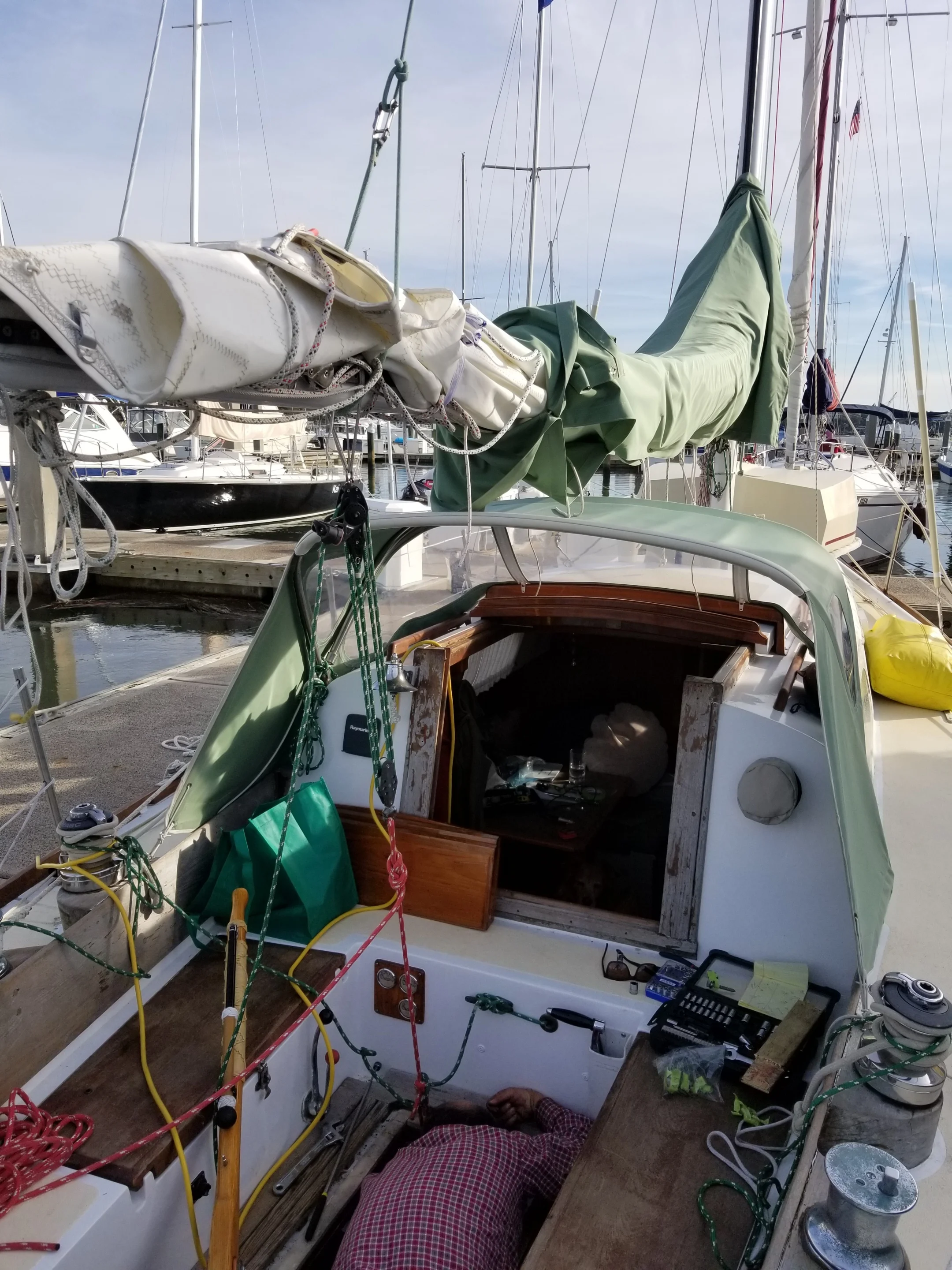 Note that when we use the boom as a crane, we attach the main halyard opposite the lifting tackle. This way, the boom doesn’t bow under the load.