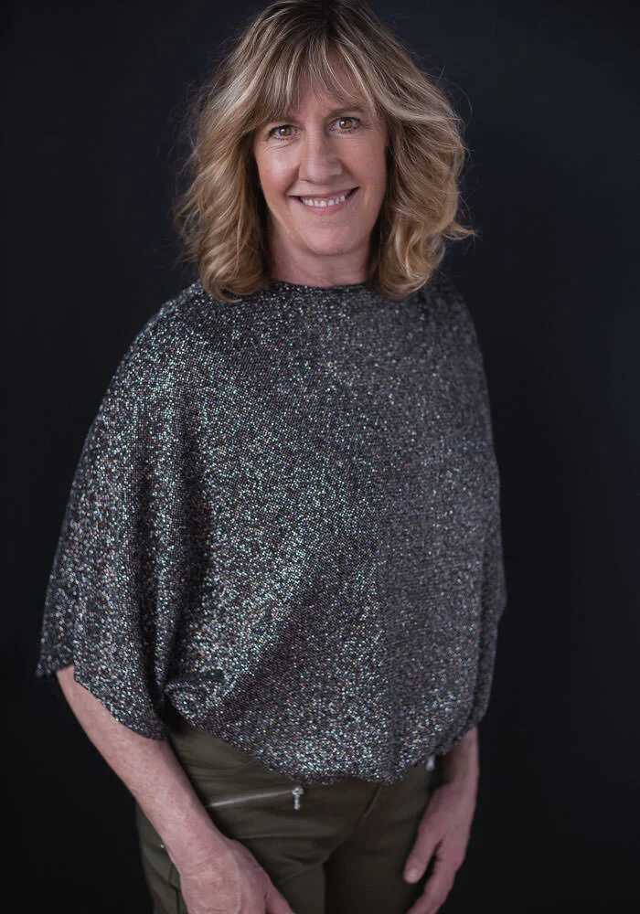 portrait of smiling woman in sequin top