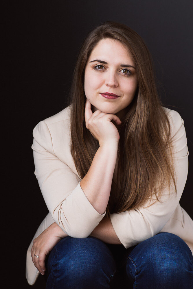 corporate headshot of woman in beige blazer