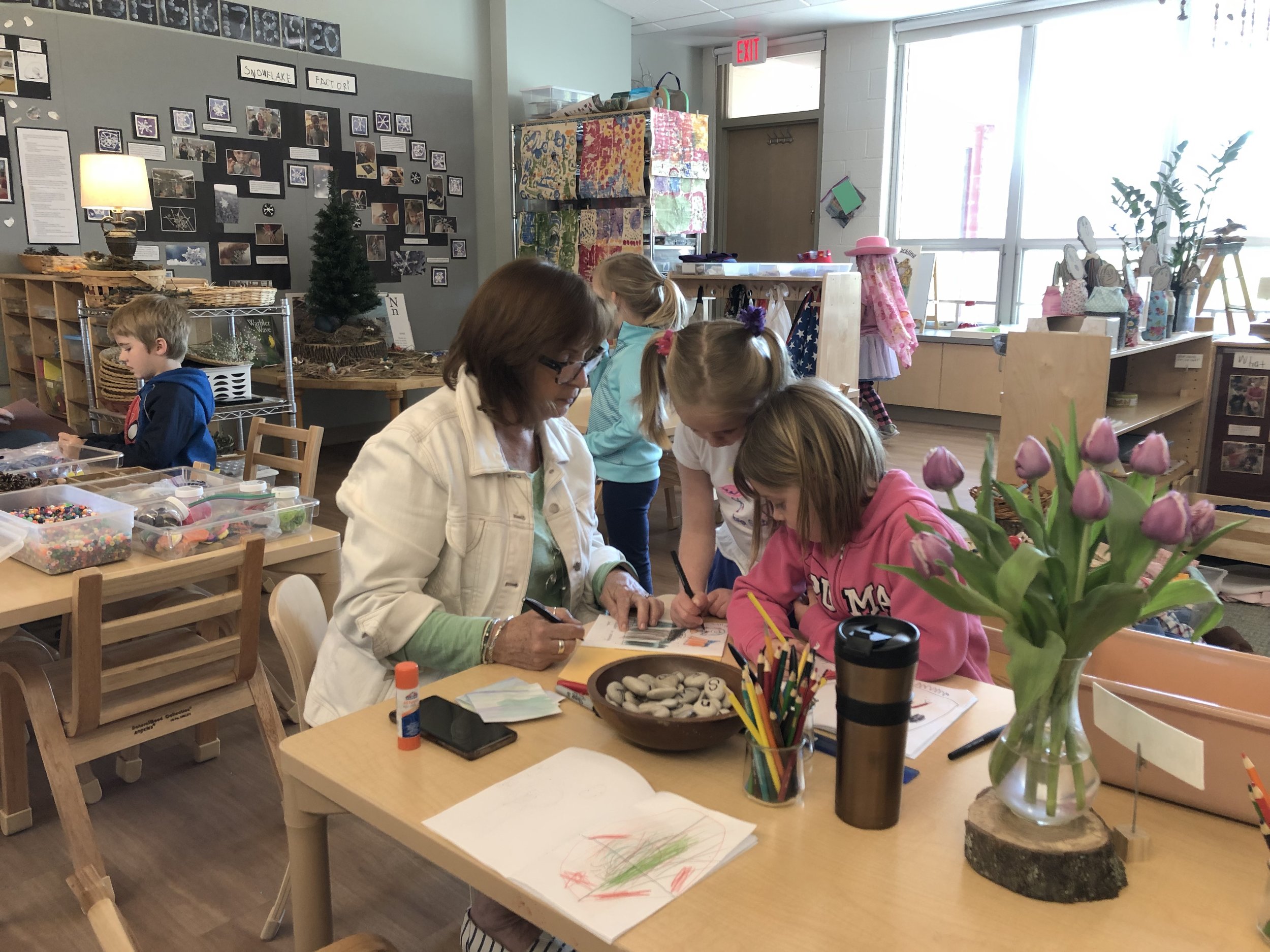 Four and five-year-olds working on messages and books, Principia School, St. Louis, Missouri