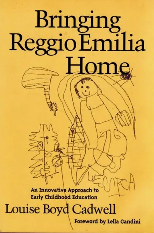 Book cover titled "Bringing Reggio Emilia Home" by Louise Boyd Cadwell with a handwritten child's drawing of a person, a lion, and other shapes on a yellow background.