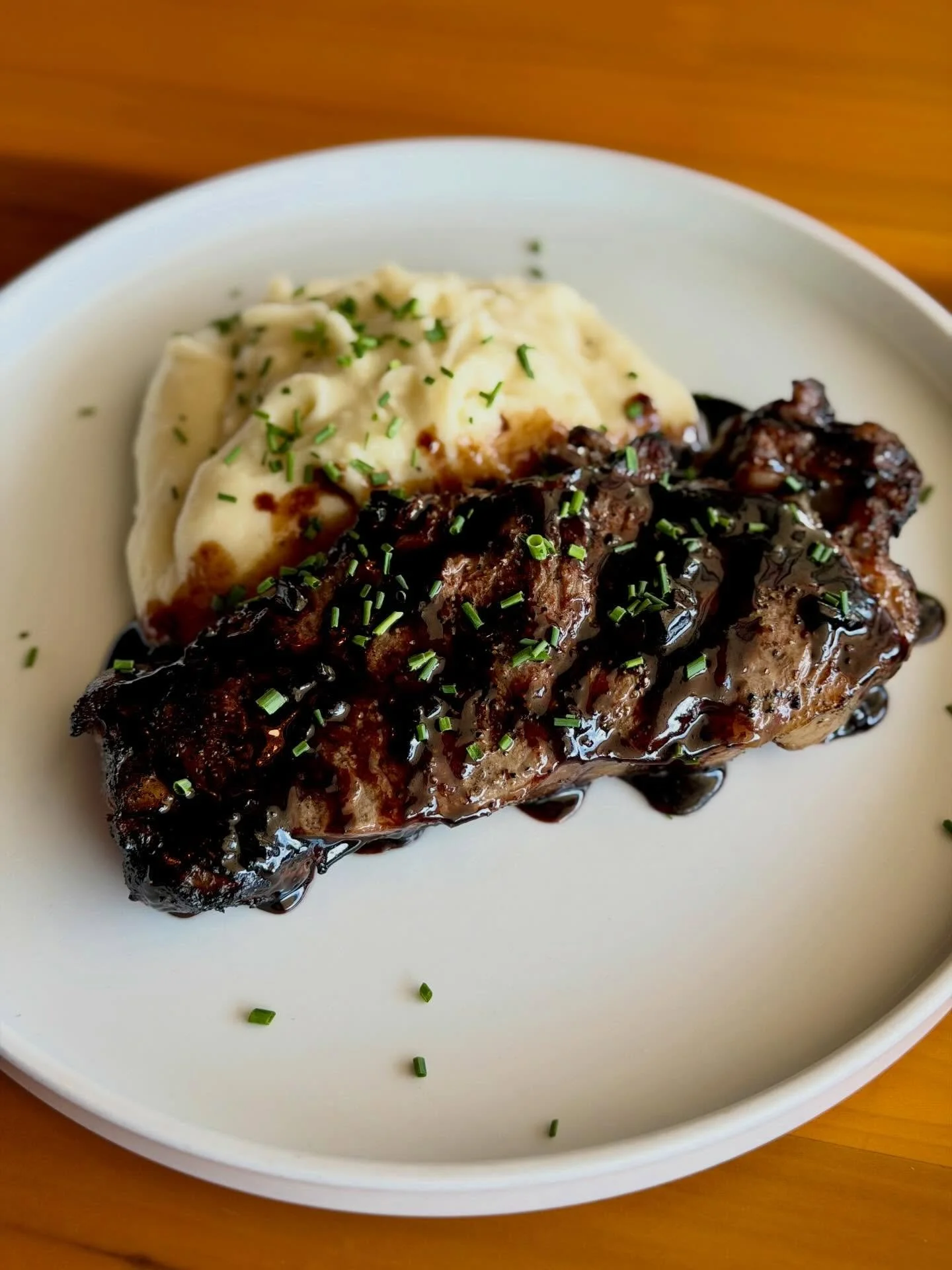 Prime New York Strip with Truffle Whipped Potatoes and a Sweet Red Wine Reduction. Bon appetite!

#dallasdining #lheats #lakehighlands #dallassteak #trufflewhippedpotatoes