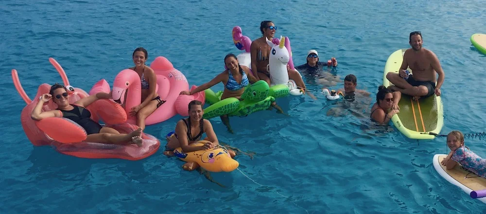 Boat buddies enjoying a floaty party off the back on S/V Bravo in Bora Bora!