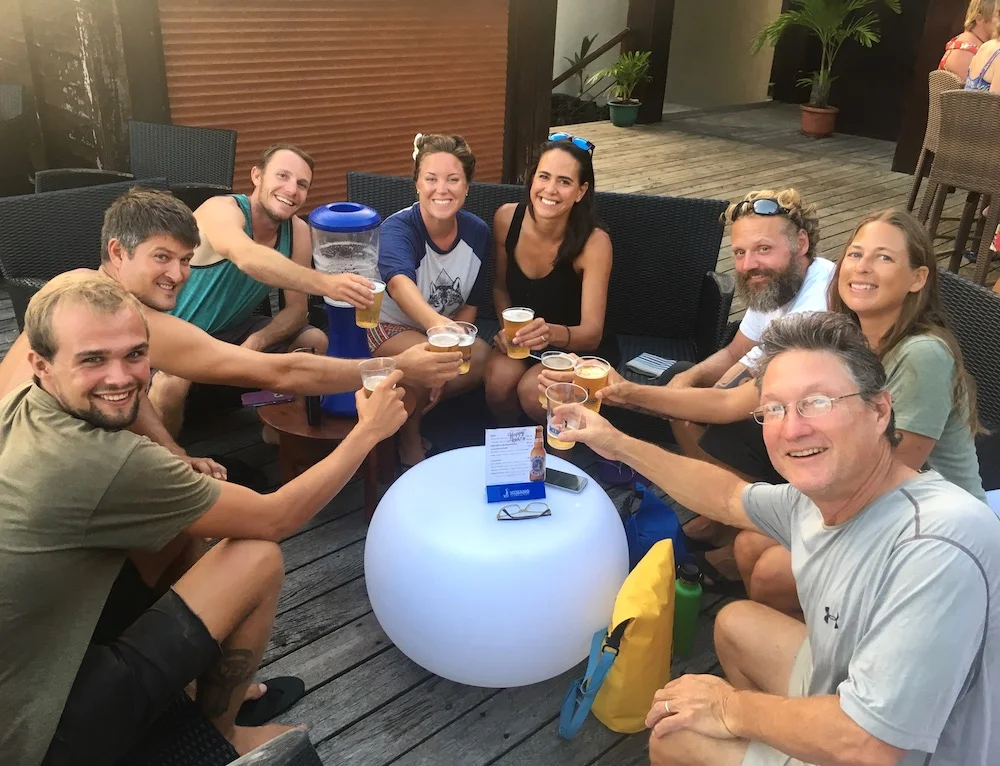 Cruising friends share a "tower" of Hinano Beer in Bora Bora before departure! Most of these friends we've been cruising with since La Cruz, Mexico!