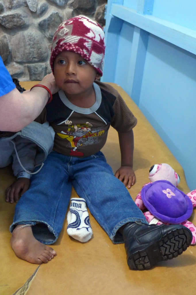 Young boy pre-surgical examination for correction of clubfoot