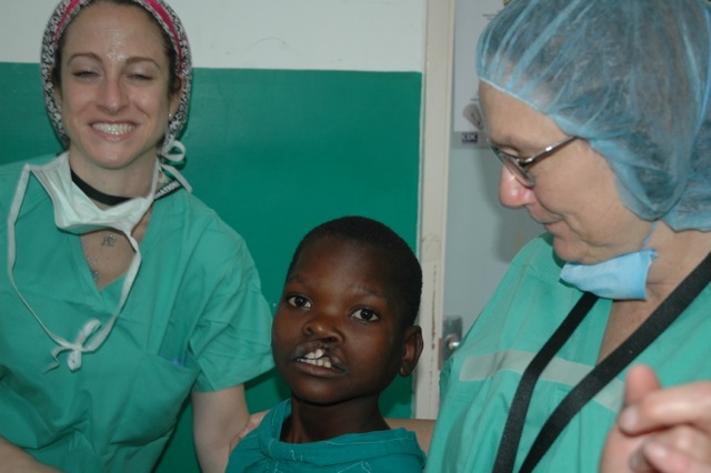 OR team waiting to operate and 12 yr old boy- cleft lip