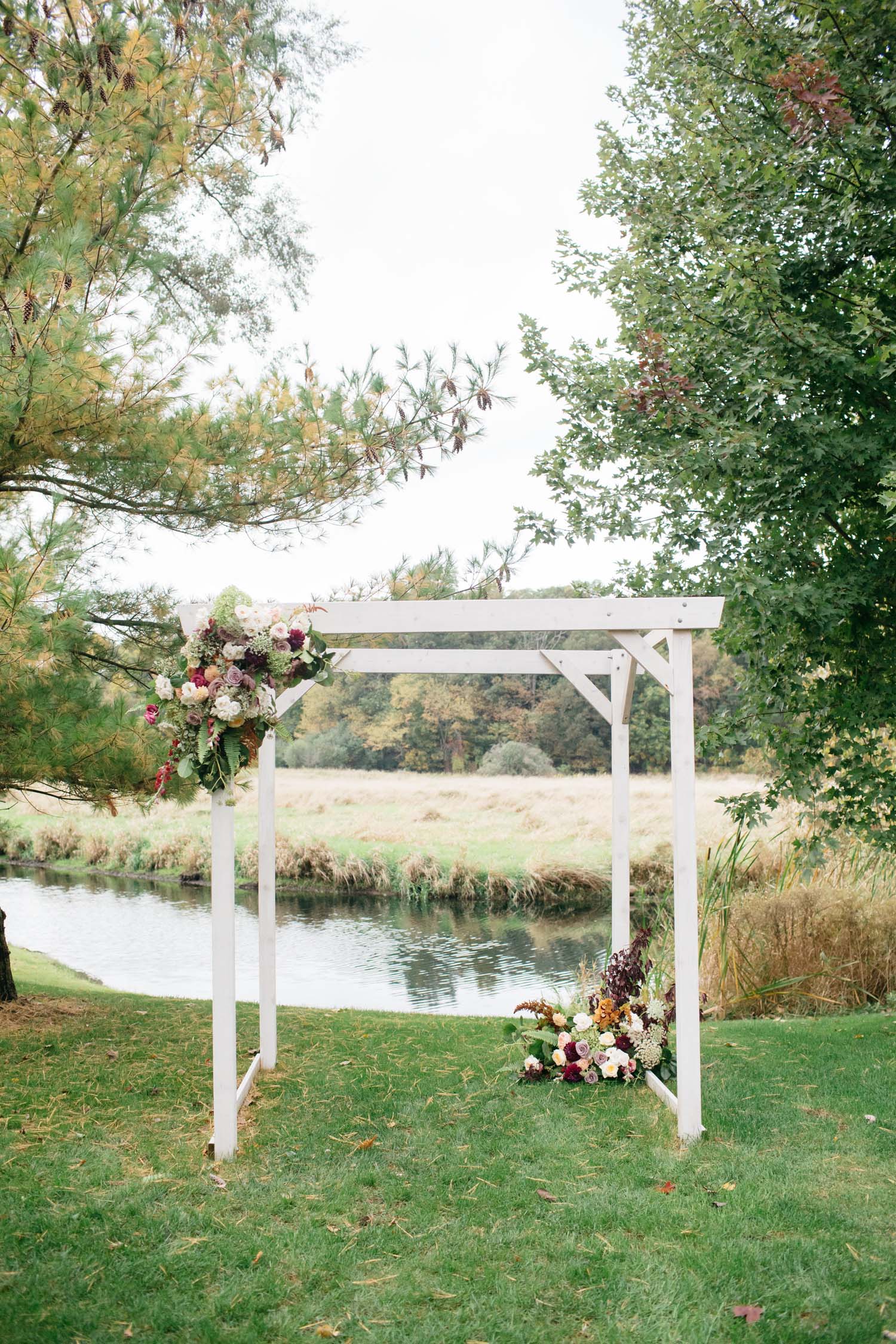 misty farm ceremony arch flowers