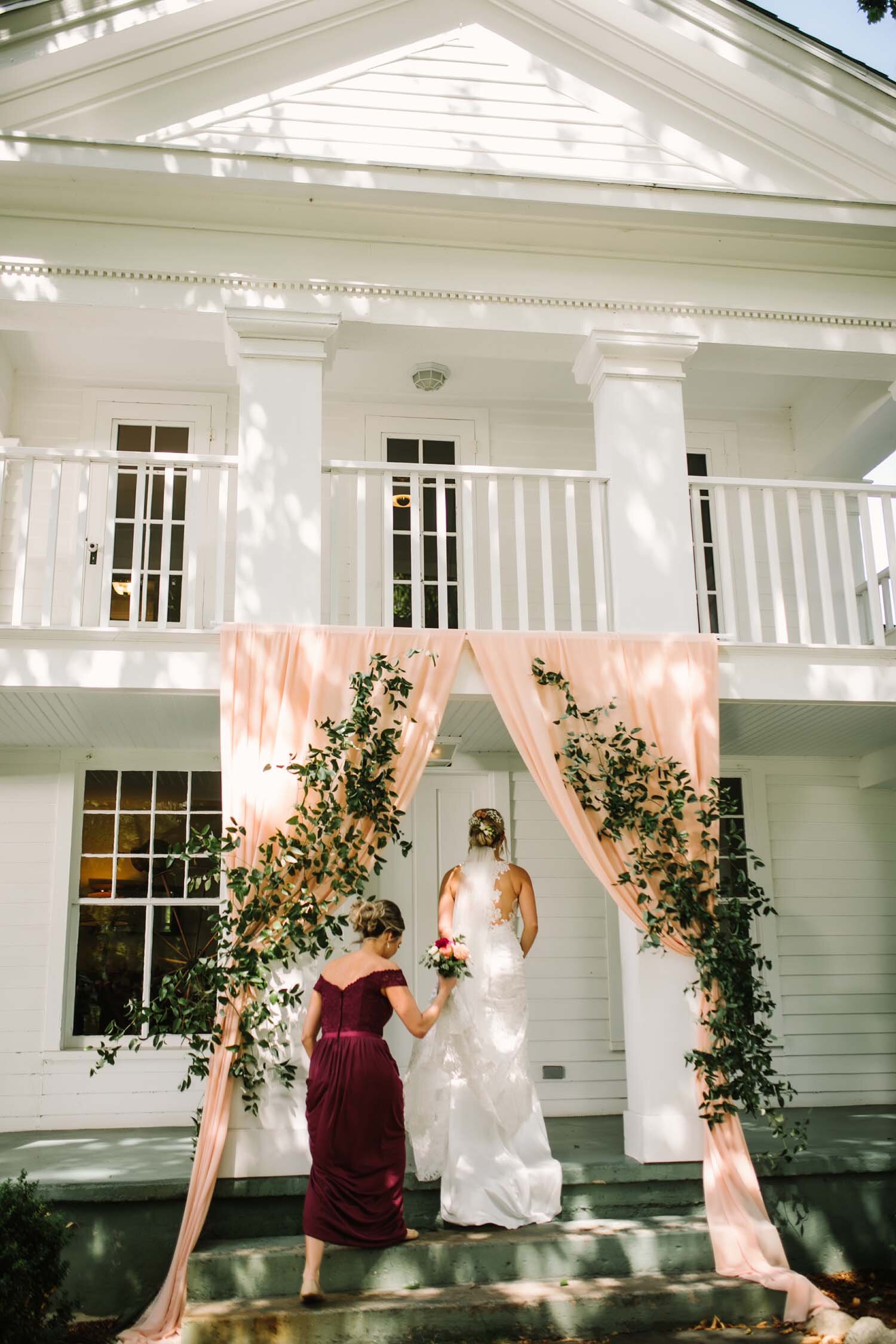 Blush fabric ceremony arch cornman farm