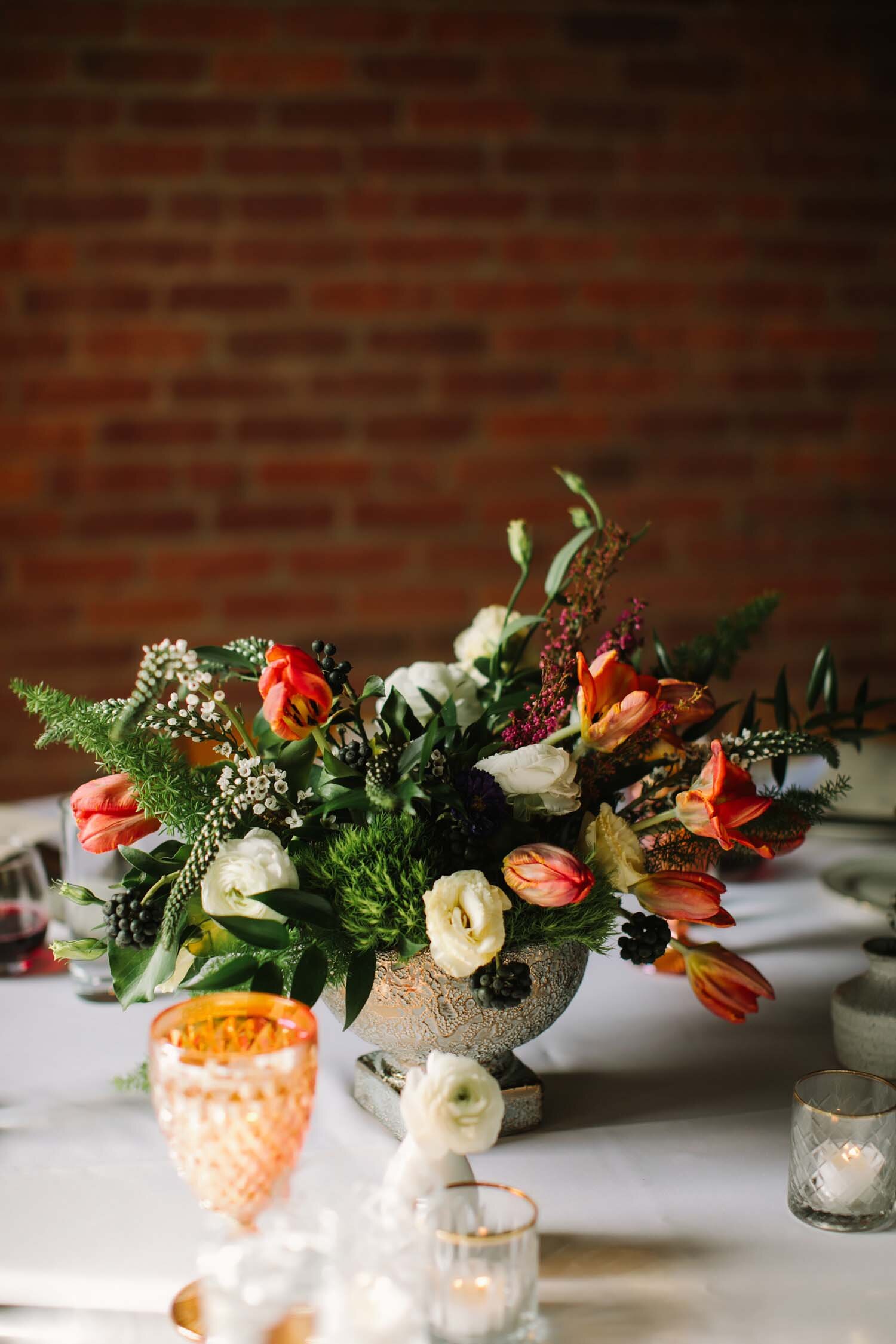 Centerpiece with orange and amber candles