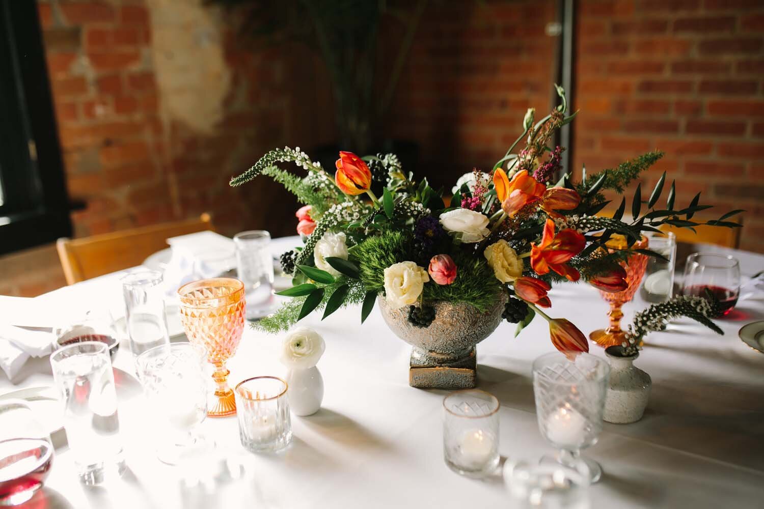 Winter centerpiece by red poppy floral design