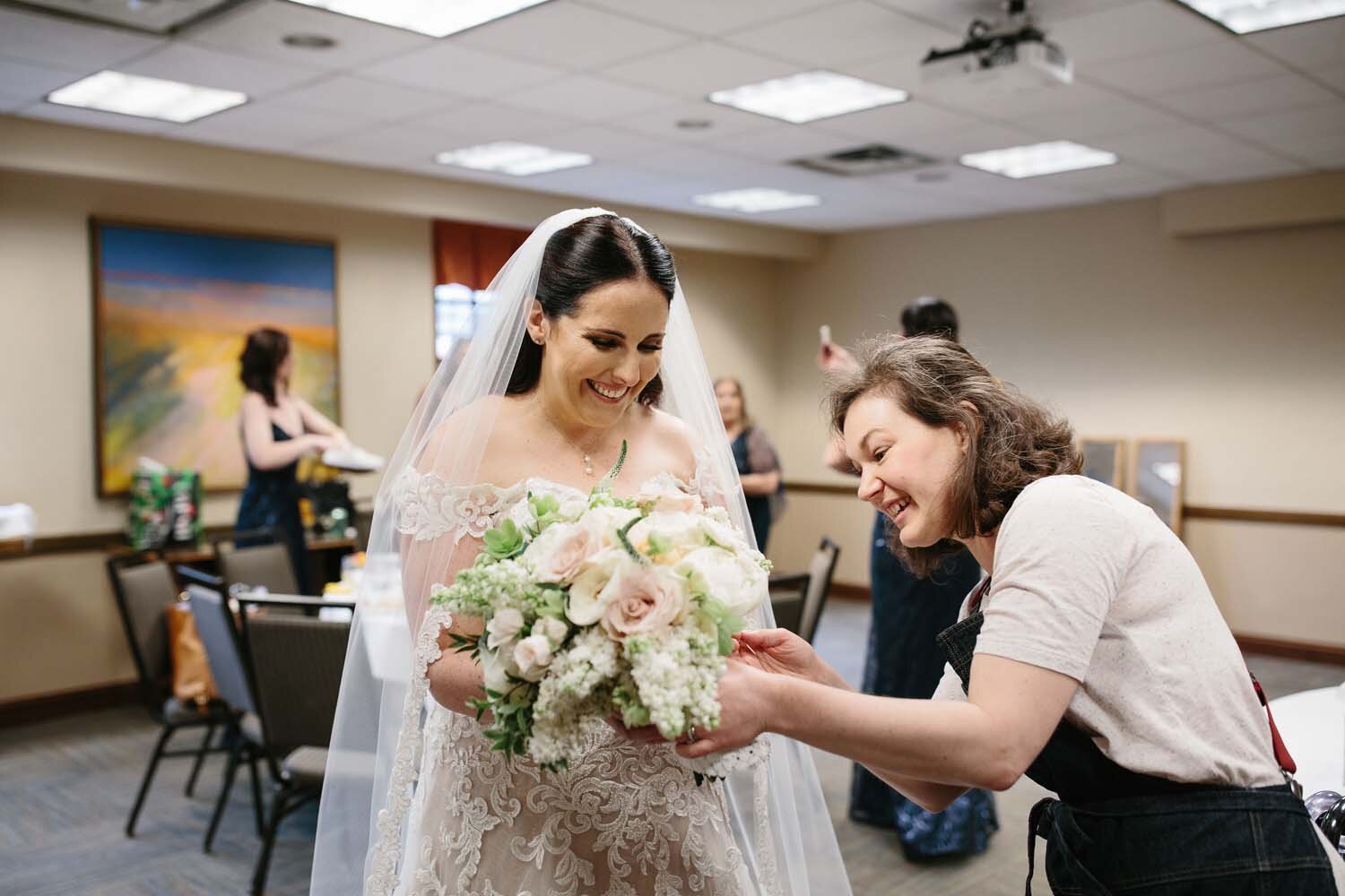 delivering a bouquet to a happy bride