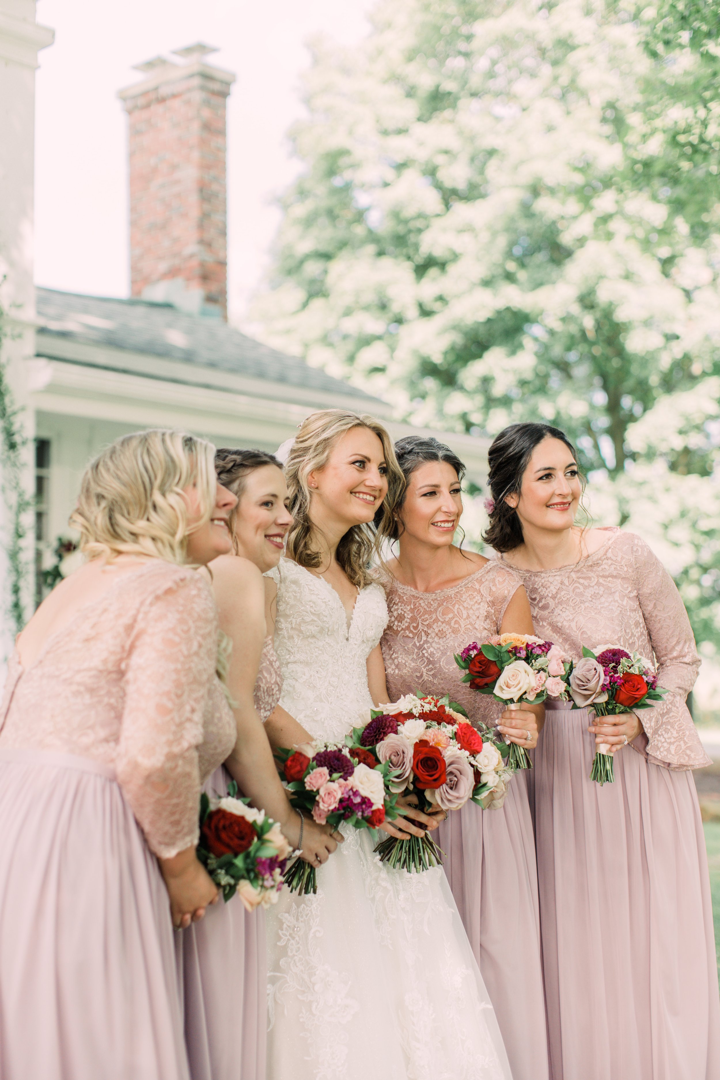 bride and bridesmaids at cornman farms wedding