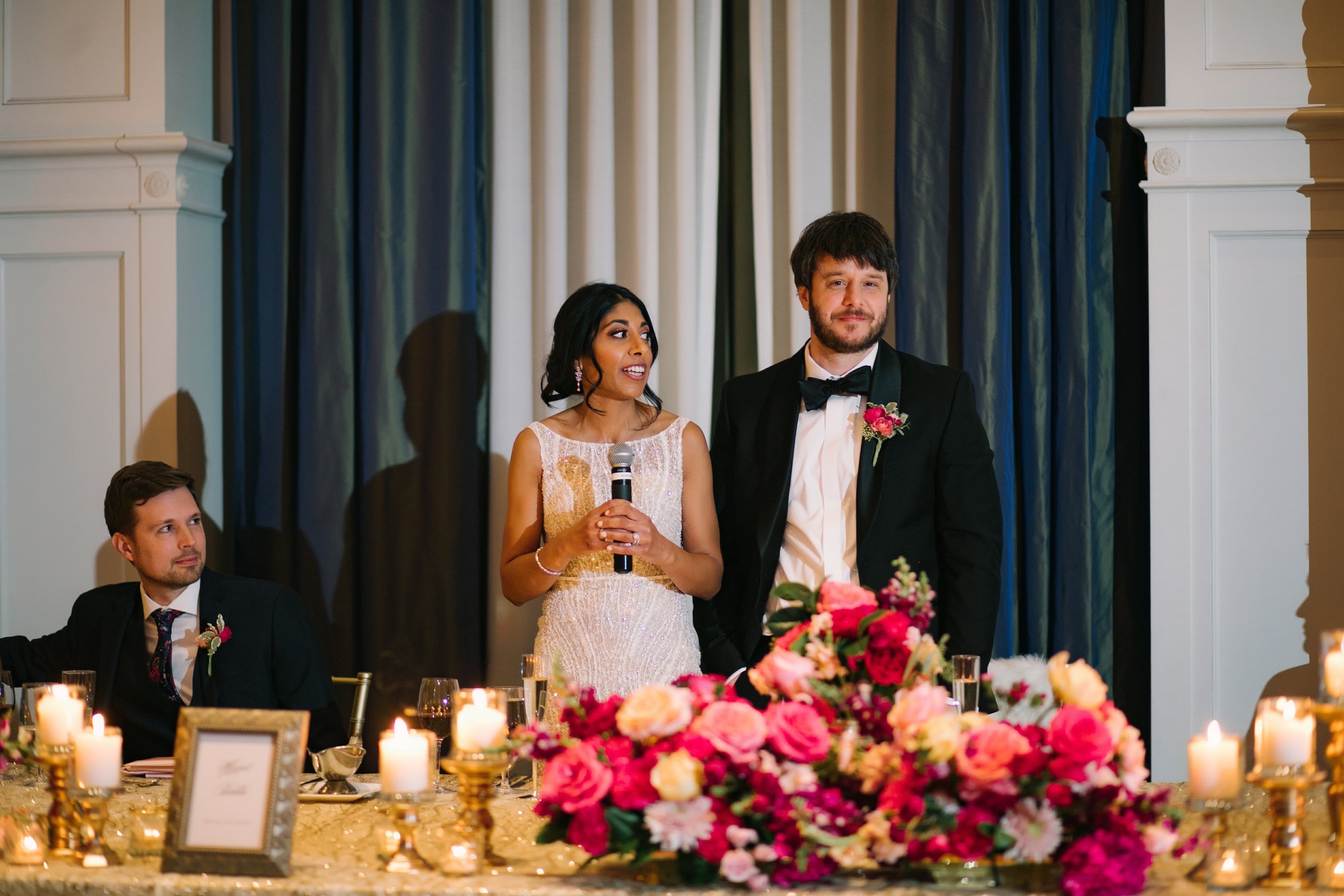 Elegant head table by red poppy floral design