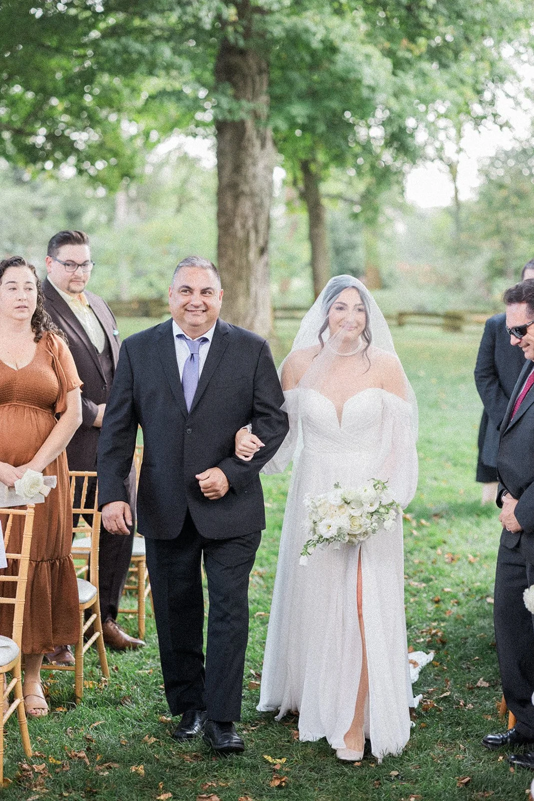 Bride walks down the aisle at Cornman Farms