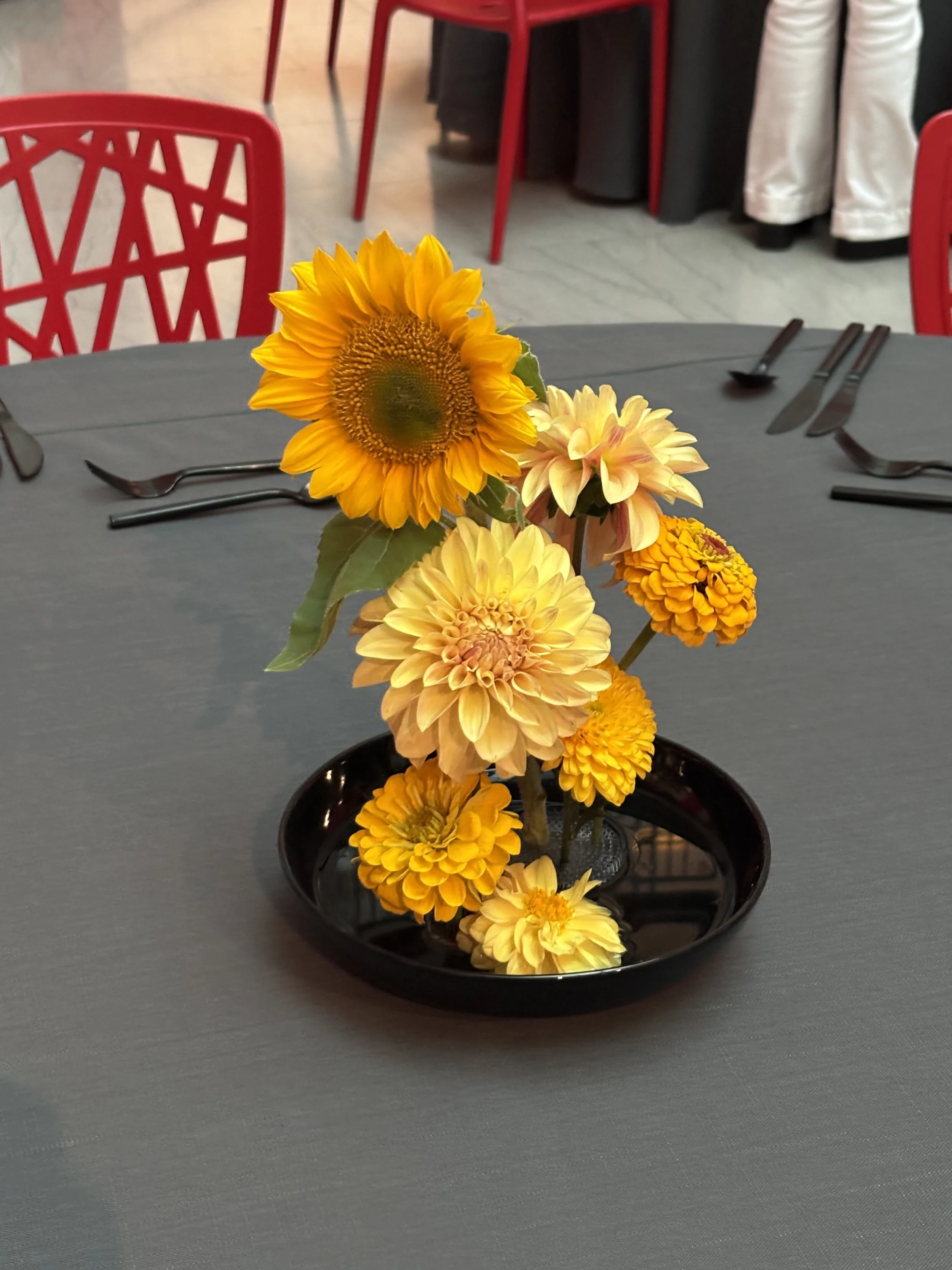 Yellow flower centerpiece at UMMA