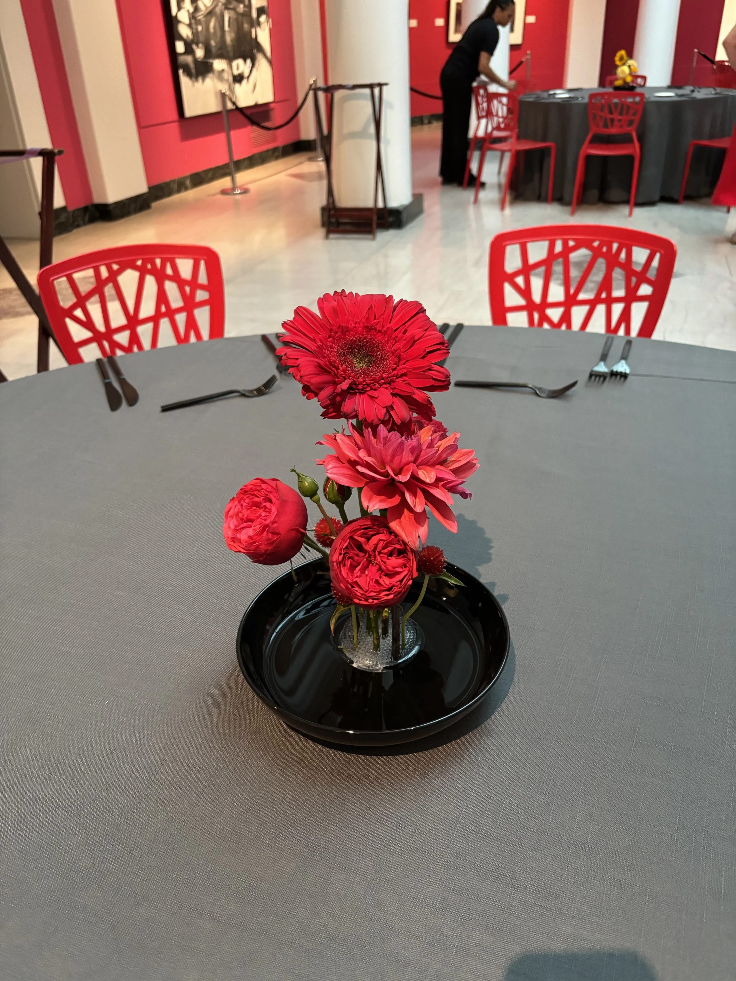 Bold red flower centerpiece at UMMA
