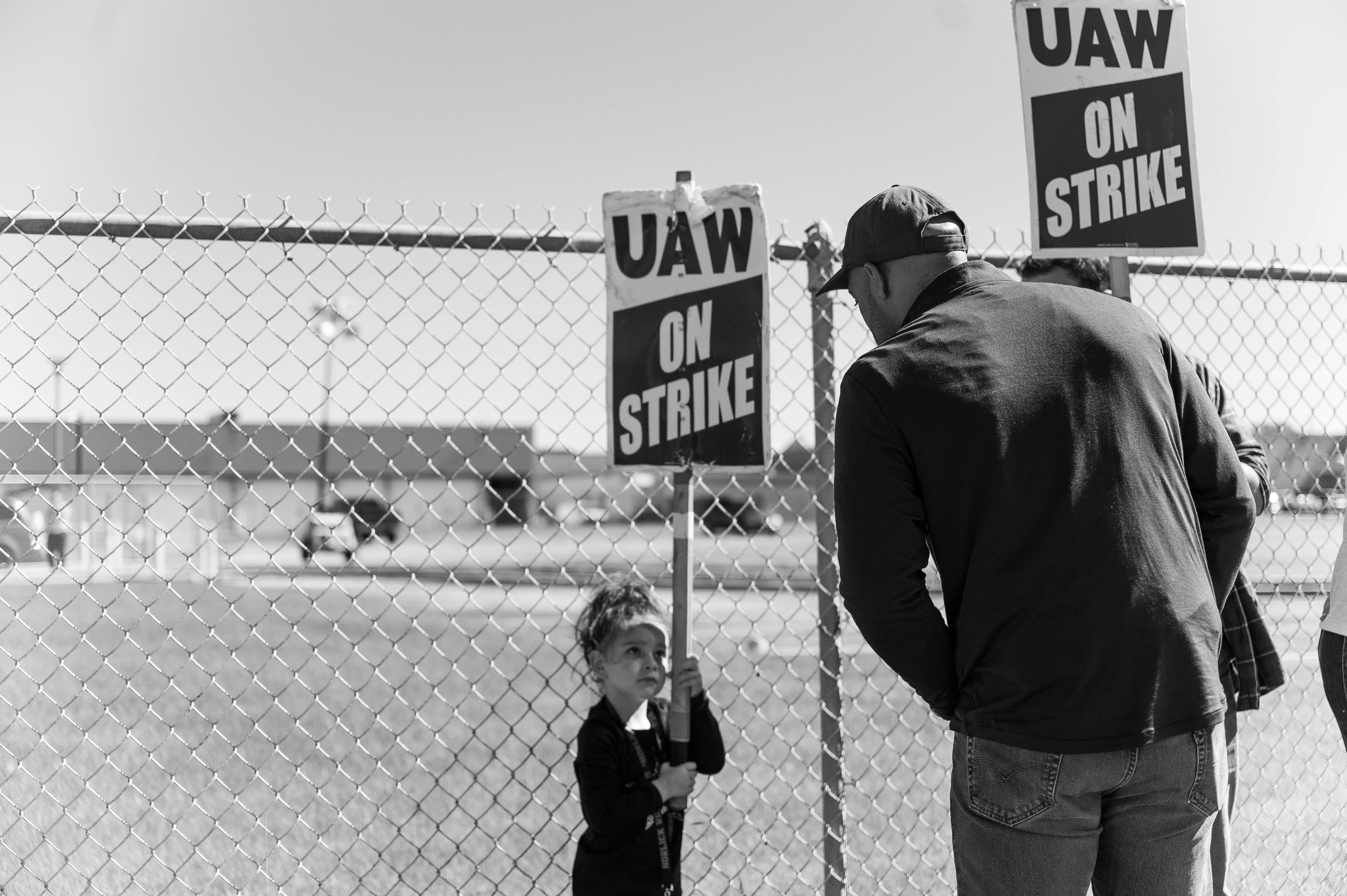 Democratic nominee for U.S. Senate, Lt. Governor Mandela Barnes speakers to the daughter of a CNH worker at a UAW Strike in Wisconsin, 2022