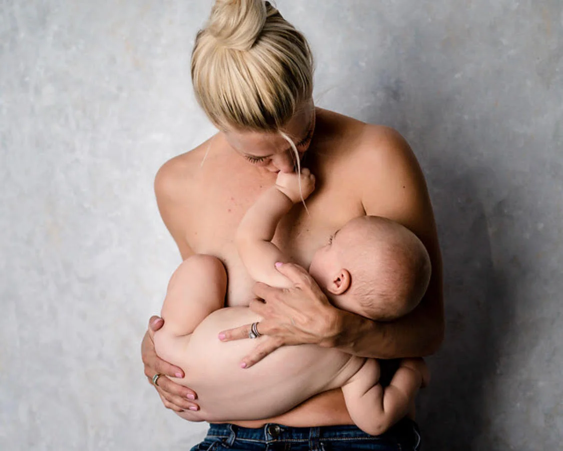 Mother breastfeeding baby