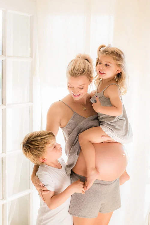 Erin Erenberg, pregnant, with two children