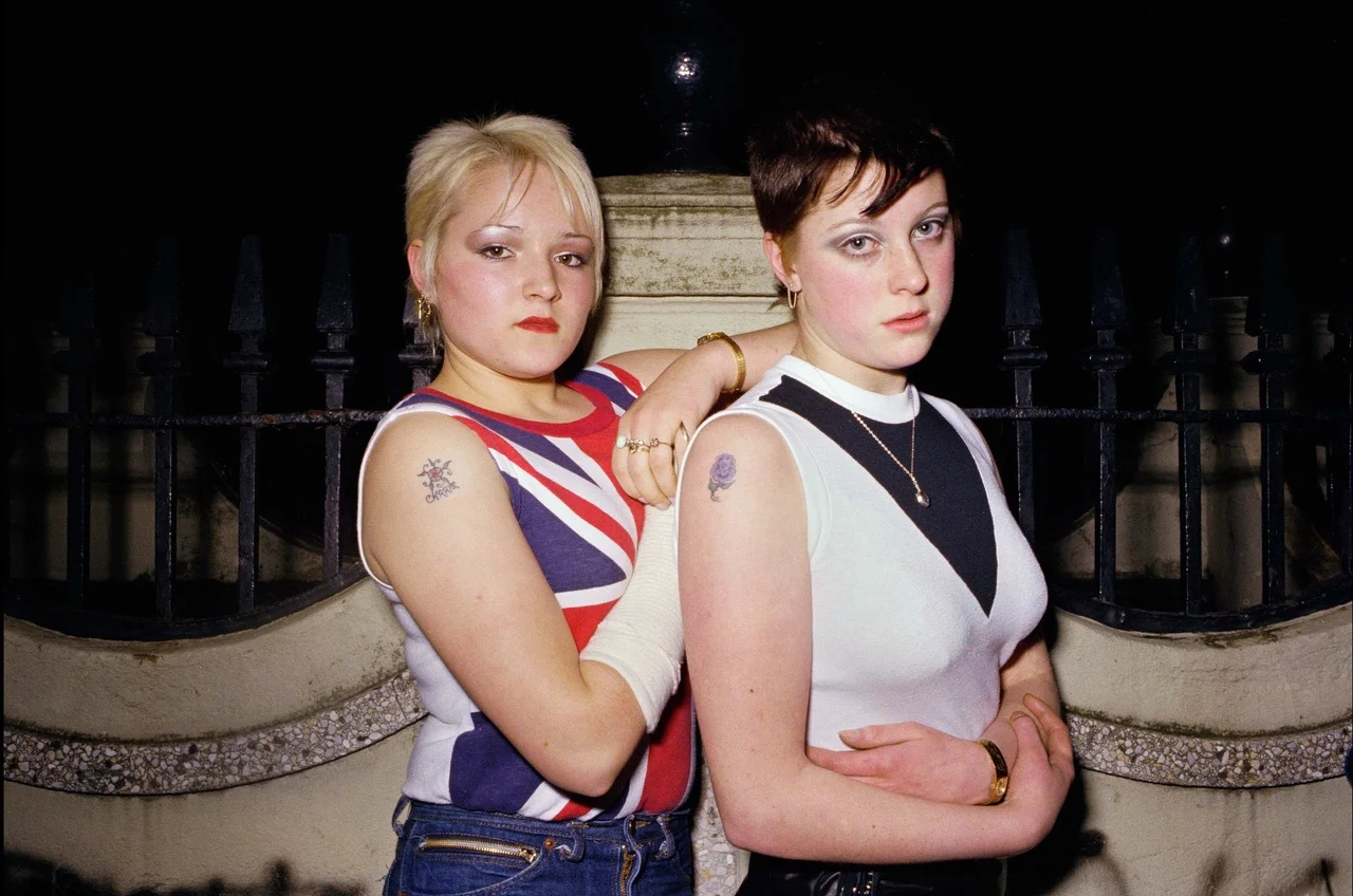 Carrie-Kirkpatrick-left-and-Gill-Soper-outside-the-toilets-in-Crystal-Palace-London-in-November-1980.jpeg