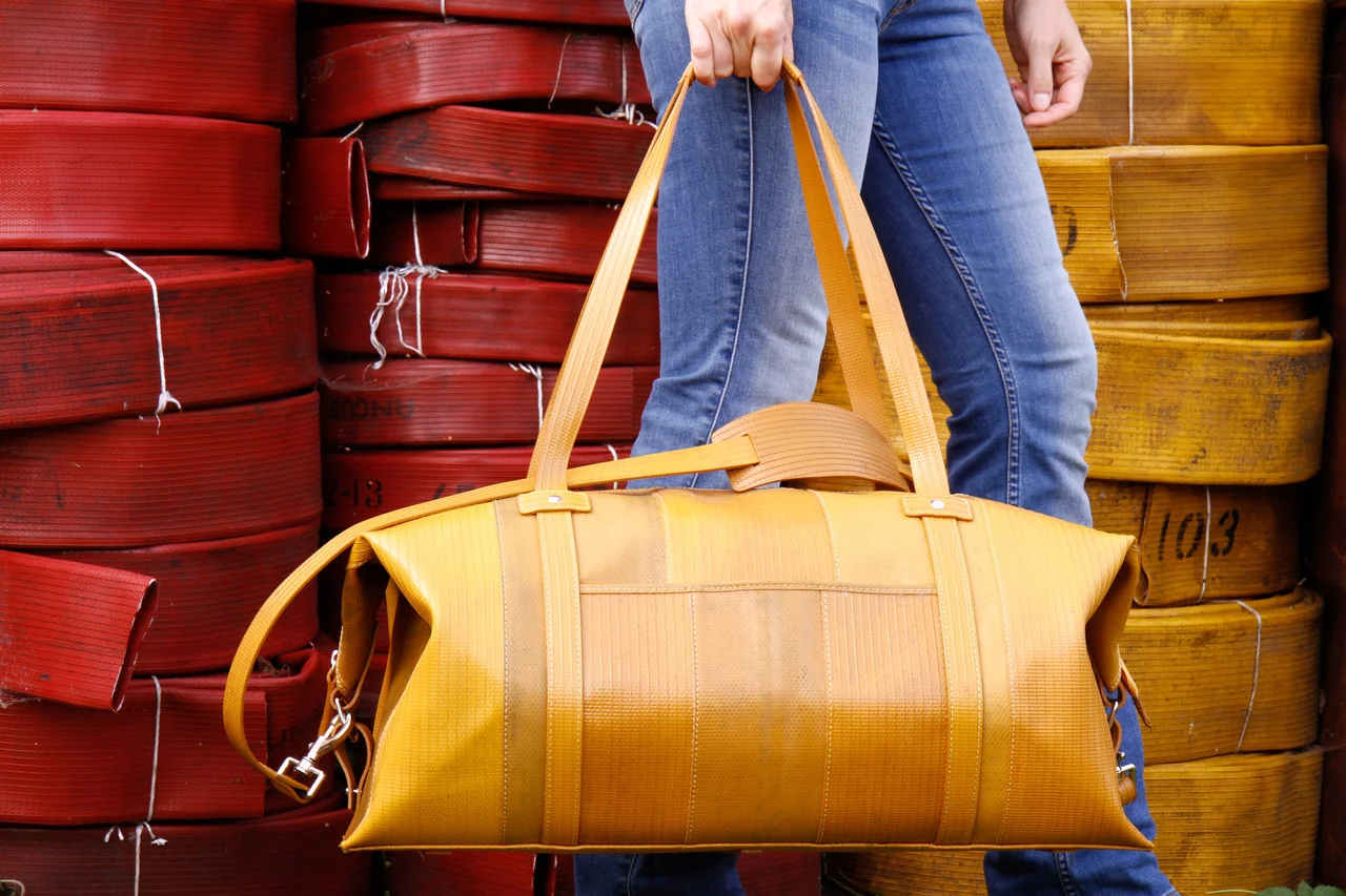 Elvis & Kresse’s weekend bag looks proud of its origins as decommissioned firehose. Picture: Elvis & Kresse.