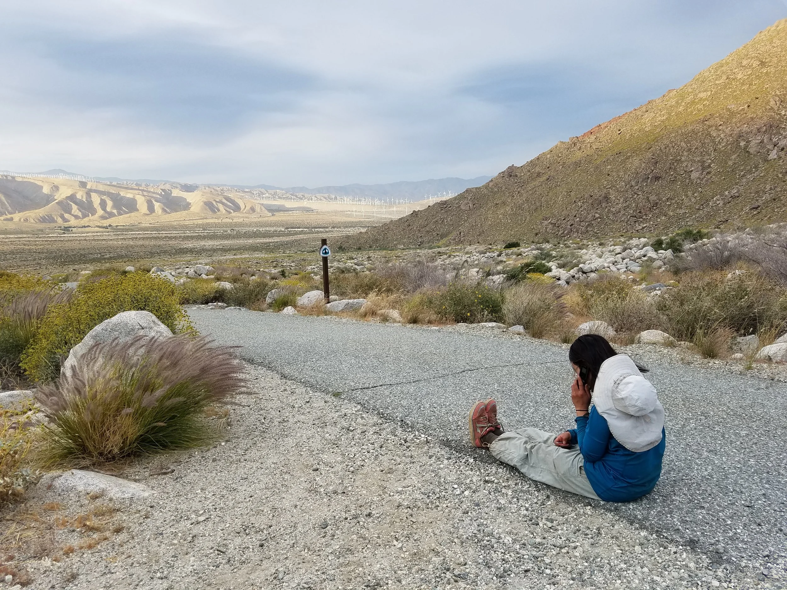 Convict giving her girlfriend Liz a call above the I-10. Liz is the best. She bought me gummy bears once, forever ensuring homie-status.