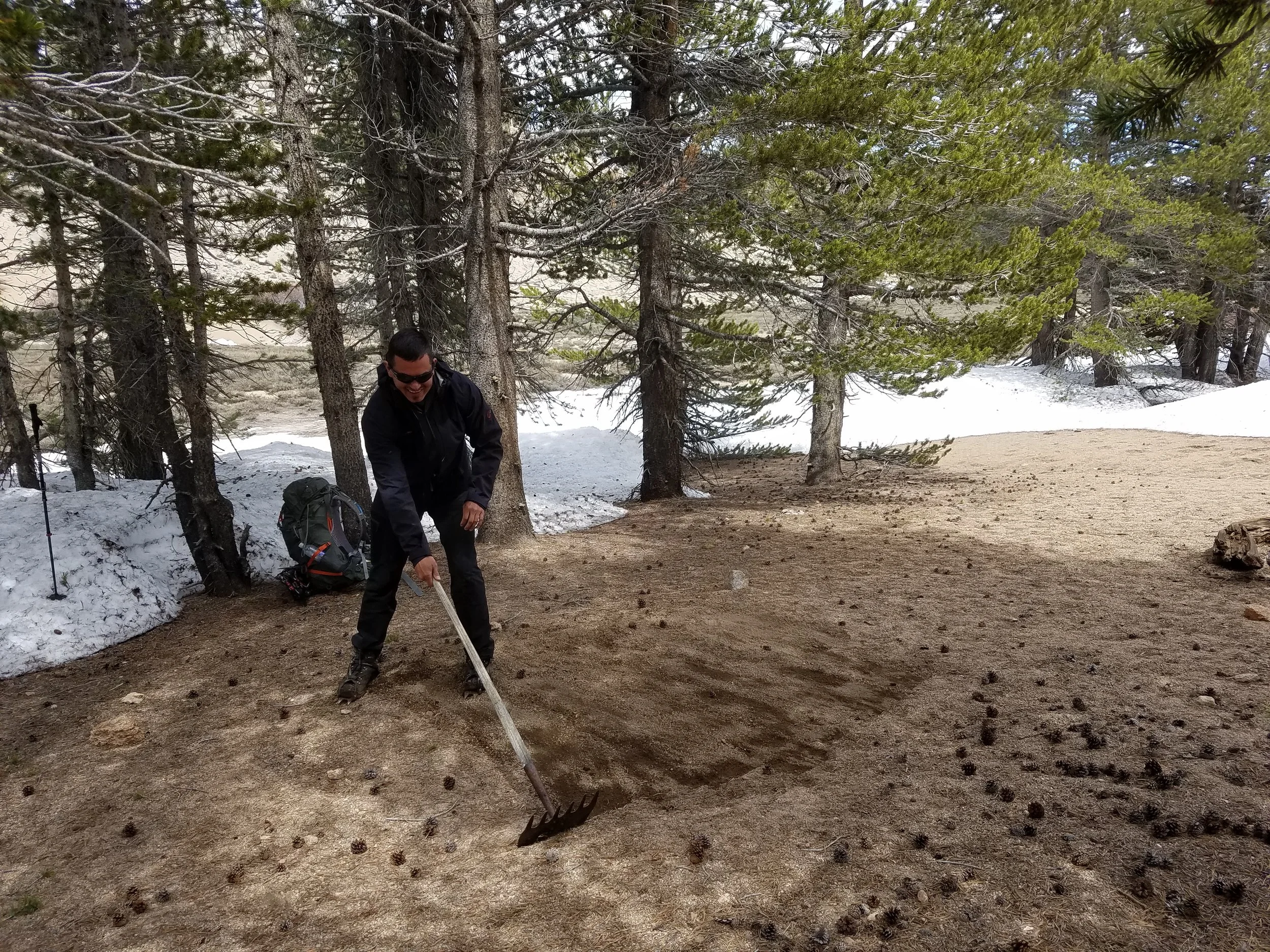 Farm boy tending to his tent site.