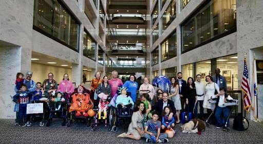  A large group of Little Lobbyists pose in Halloween costumes in a hallway of the Hart Senate Office Building during Halloween on the Hill. 