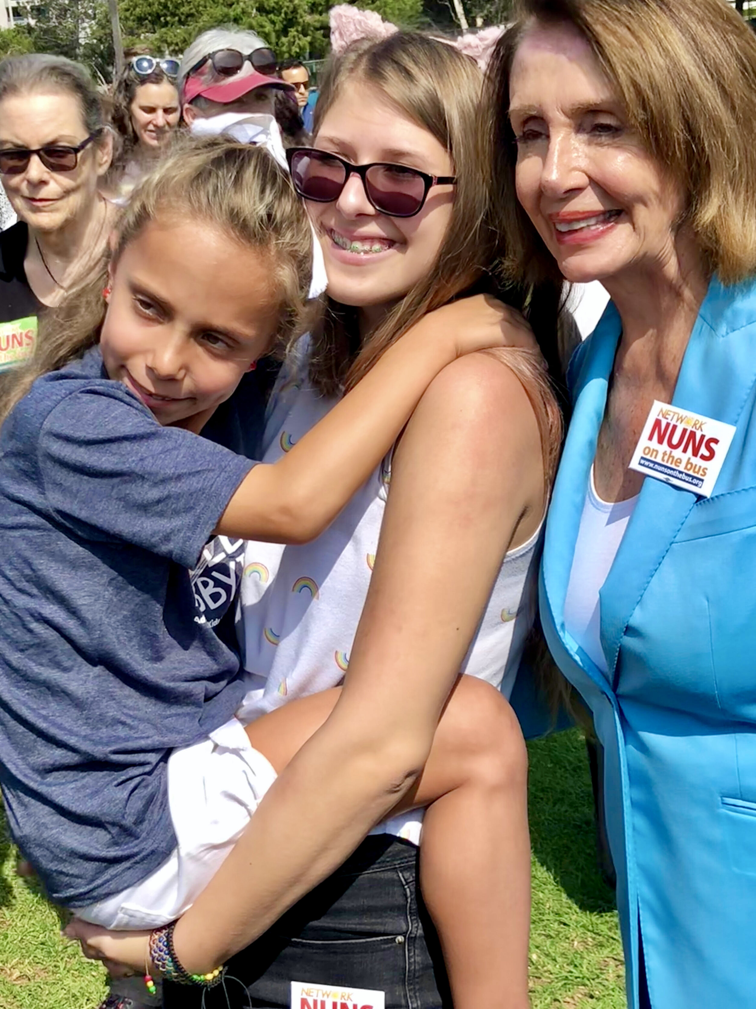  A Little Lobbyists mom holds her daughter while posing with the Speaker of the House. 