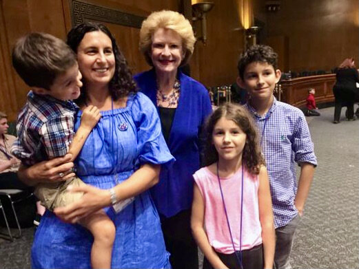  A Little Lobbyists family poses with a U.S. Senator. 