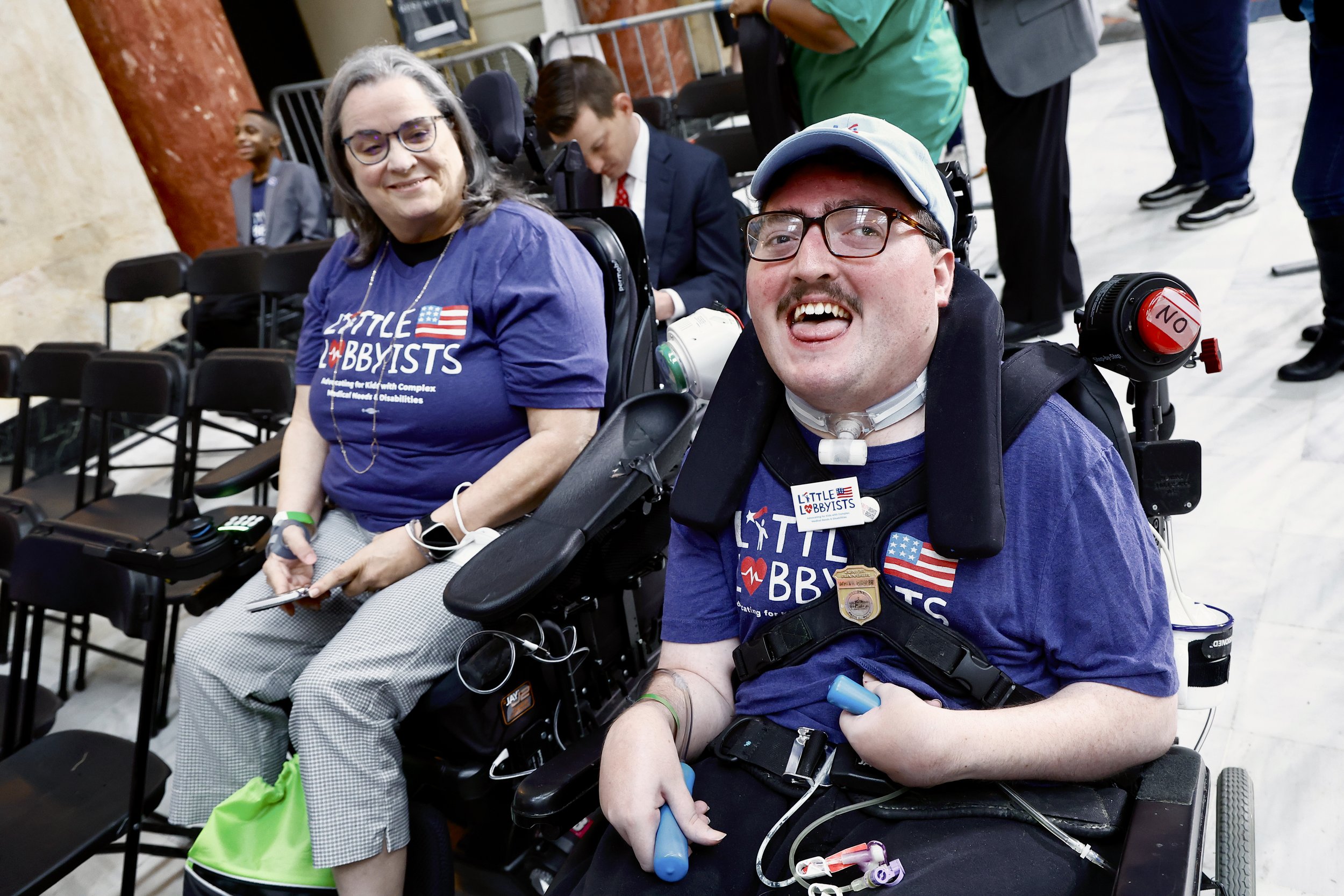  Stephanie and Rob pose in their wheelchairs inside the ADA section at the rally. 