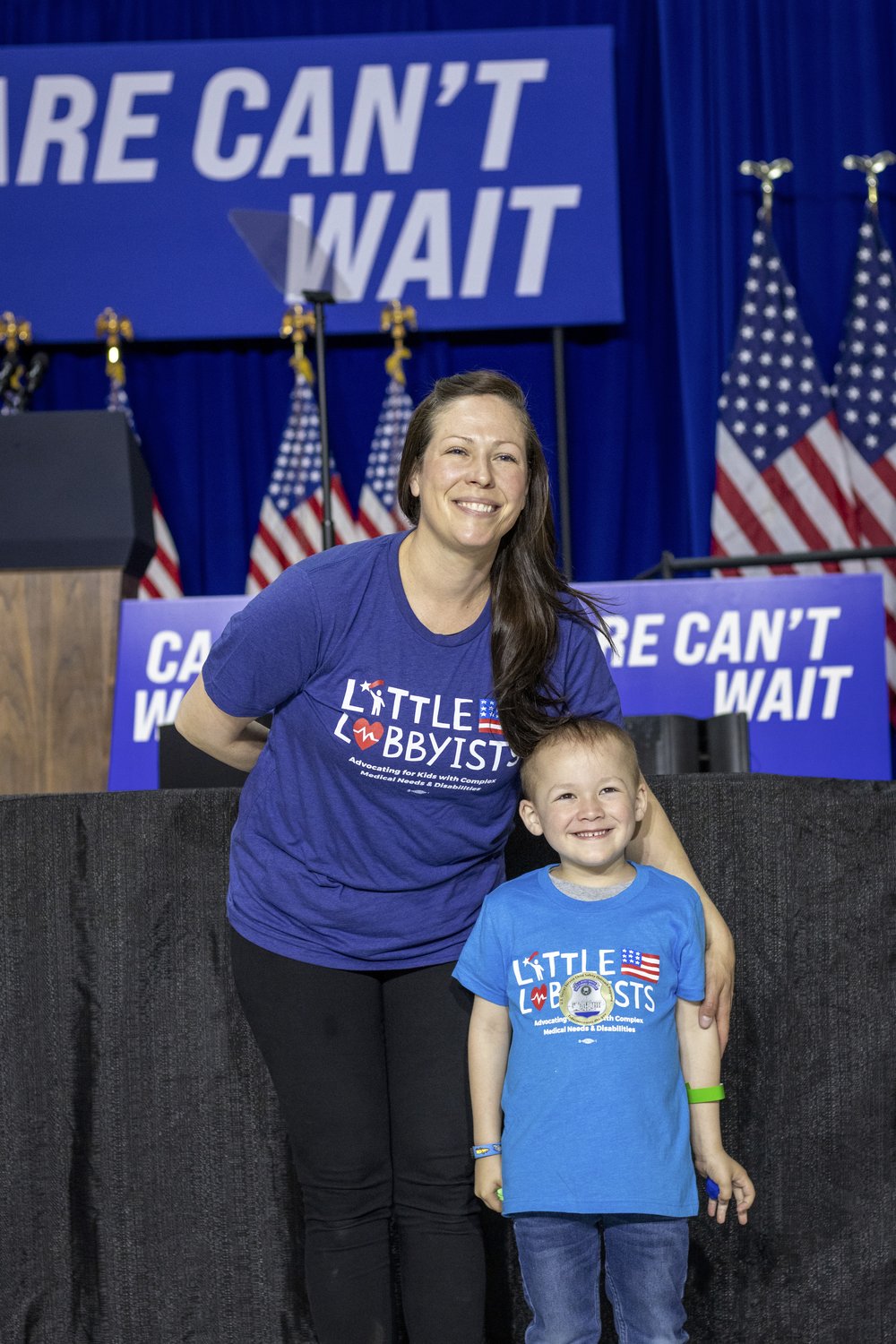  Megan and her young son Gabe pose in front of the stage. 