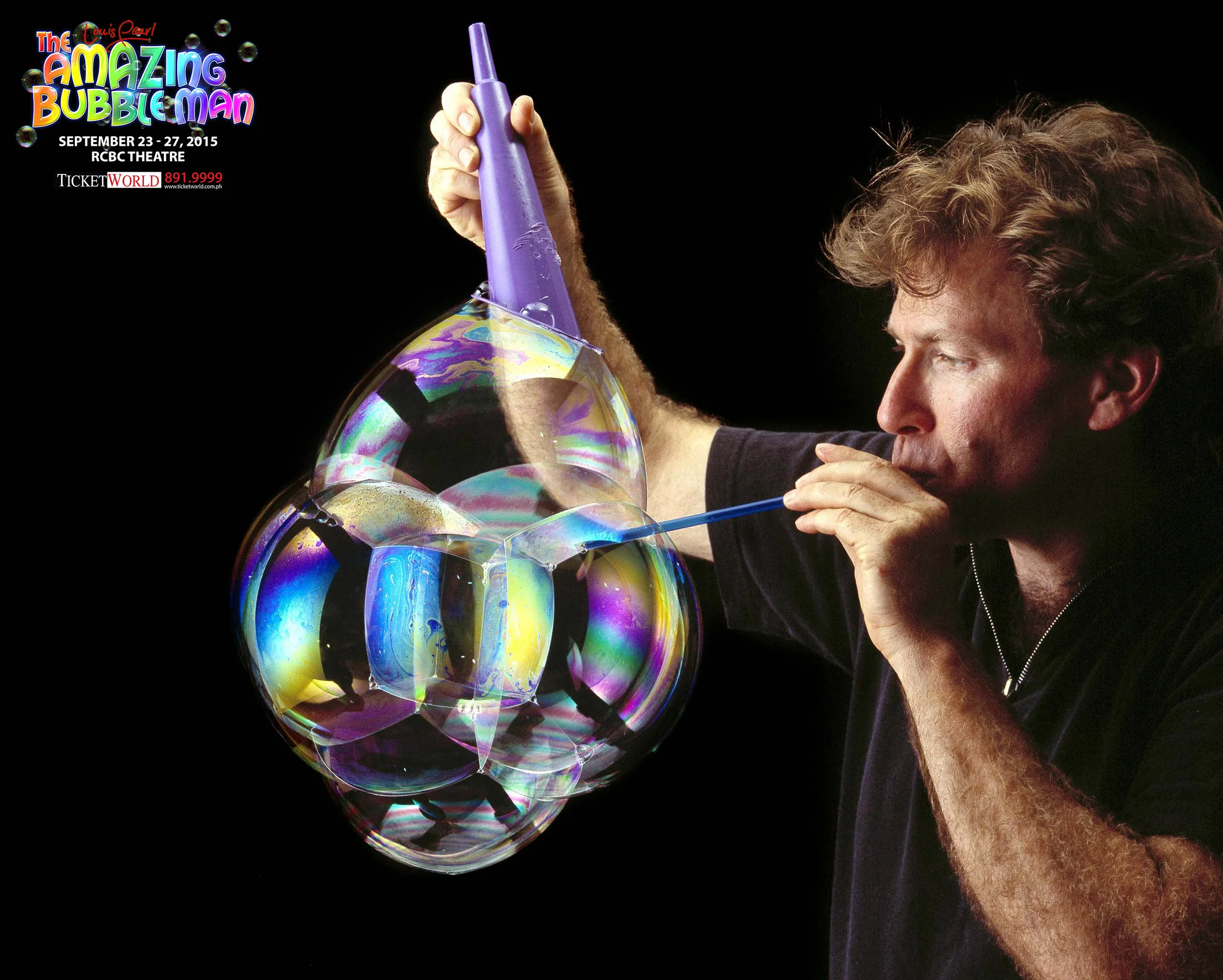 Louis_blowing_w_purplecone.jpg