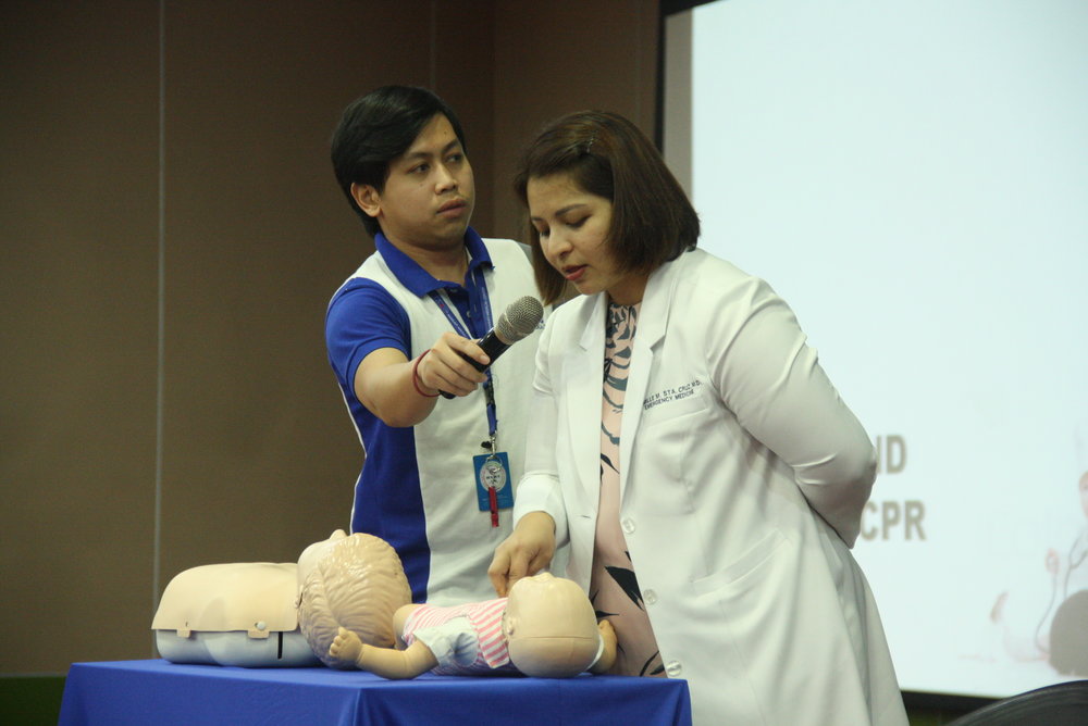 Dr. Camille Sta. Cruz, Emergency Medicine Doctor, demonstrating proper first aid for babies